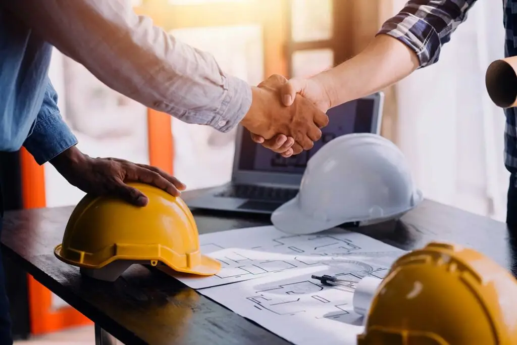Shaking of hands to celebrate winning a construction contract