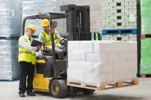 Man undertaking forklift training with supervisor