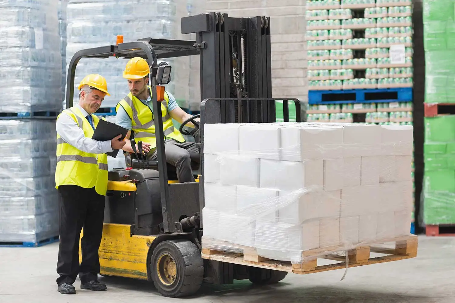 Man undertaking forklift training with supervisor