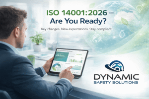 Business professional reviewing ISO 14001 environmental management dashboard on tablet, highlighting sustainability and compliance ahead of 2026 changes